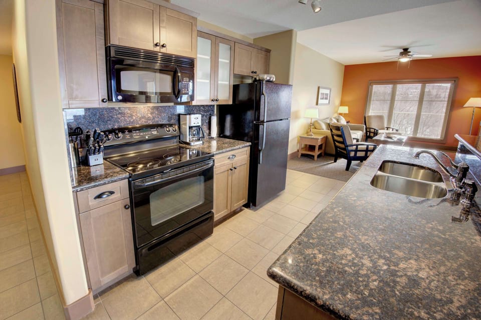 Penthouse, 1 King Bed with Sofa bed (1 Bedroom) | Private kitchen | Coffee/tea maker, full-size fridge, microwave, oven