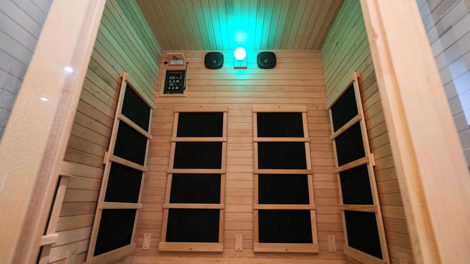 Private infrared sauna with warm wood finishes and spa-like ambiance