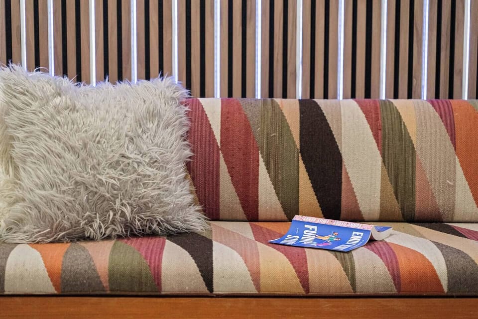 Chic details and soft textures make this corner perfect for relaxing with a book