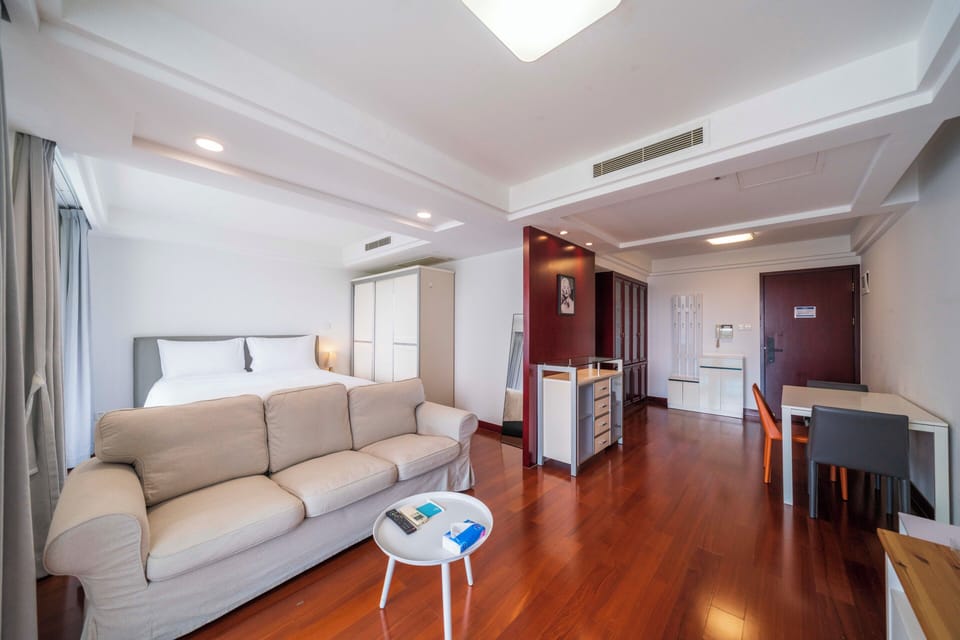 Superior Apartment, 1 Bedroom, Kitchen, City View | Living room | 55-inch Smart TV with cable channels