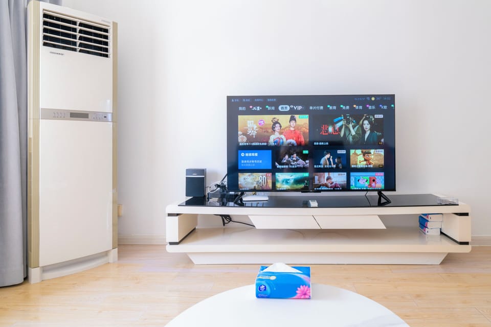 Superior Apartment, 2 Bedrooms, City View | Living room | 55-inch Smart TV with cable channels