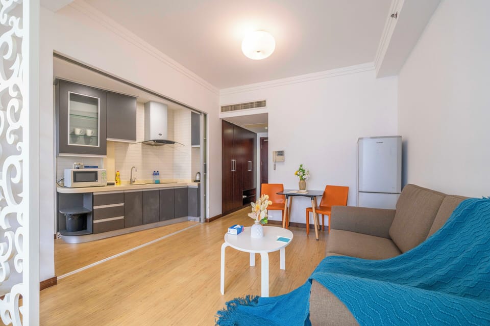Superior Apartment, 1 Bedroom, Kitchen, City View | Living room | 55-inch Smart TV with cable channels