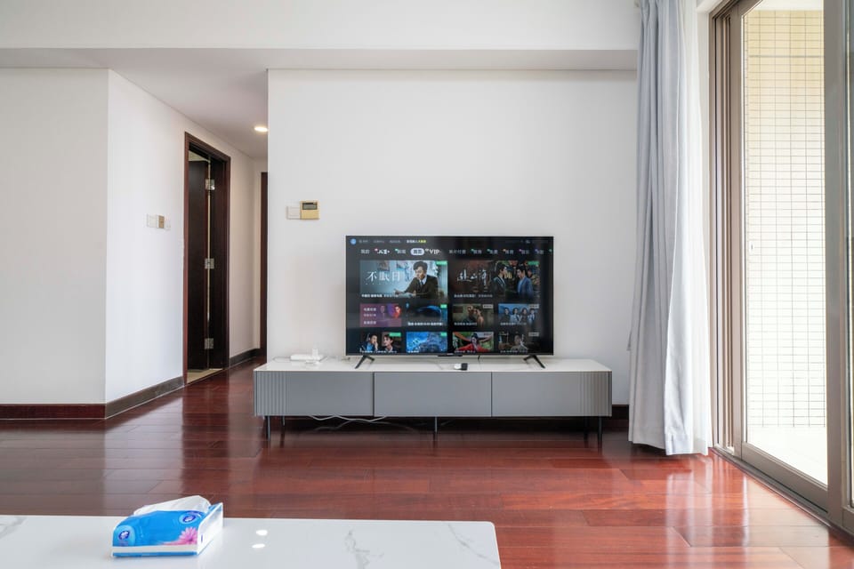 Superior Apartment, 2 Bedrooms, Kitchen, City View | Living room | 55-inch Smart TV with cable channels