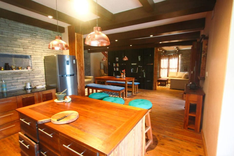 Family kitchen and dining space with natural textures and open layout.