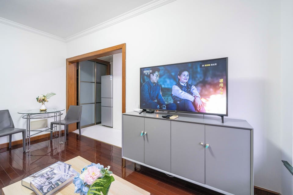 Superior Apartment, 1 Bedroom, Kitchen, City View | Living room | 55-inch Smart TV with cable channels
