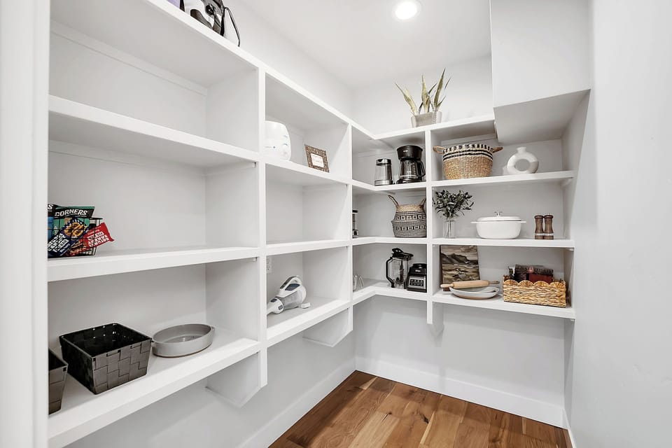 Walk‑in pantry and a wine closet keep everyone’s favorites close at hand and out of the way