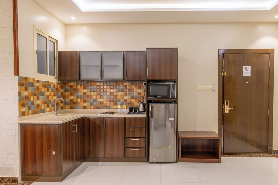 Mini-fridge, microwave, stovetop, cookware/dishes/utensils