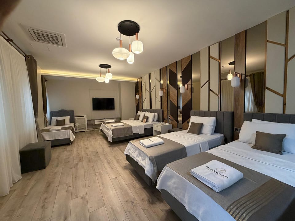 Family Quadruple Room, City View | In-room safe, desk, laptop workspace, WiFi (free)