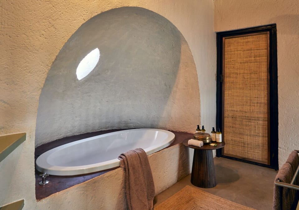 River Suite | Bathroom | Separate tub and shower, slippers, towels, soap