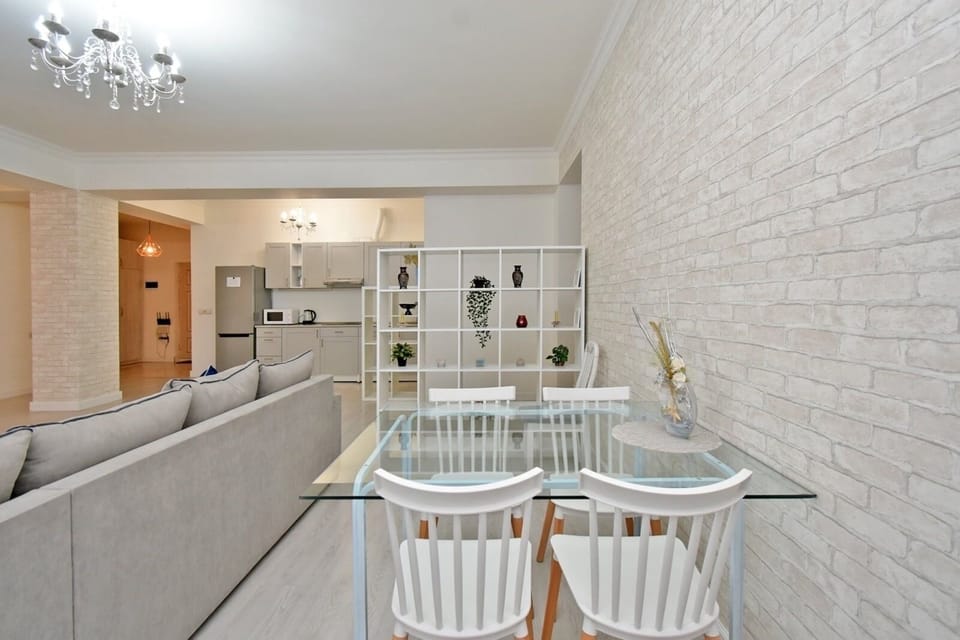Deluxe Apartment, City View | Living area | 50-inch flat-screen TV with cable channels