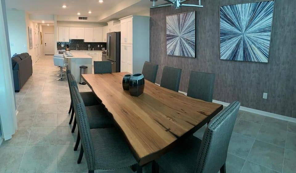 Stylish dining area with seating for eight, perfect for family meals or group gatherings