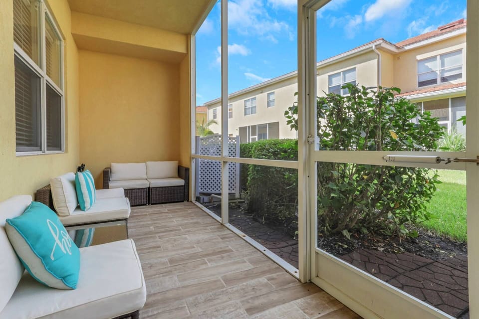 The fully screened lanai runs the width of the back of the townhome, and provides a relaxing space to enjoy the Florida sunshine.