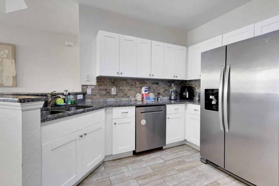 The kitchen is well equipped with full size oven, dishwasher, refrigerator/freezer and microwave.