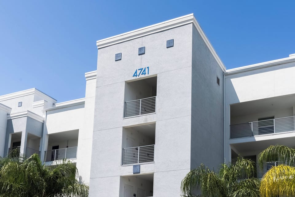 Discover the charm of our stylish exterior with a fresh white façade and modern lines that reflect sunlight beautifully. Relax on the inviting balconies and take in the lush surroundings for a perfect escape.