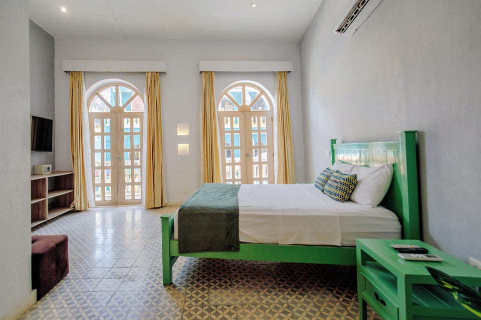 Deluxe Suite, Balcony, City View | In-room safe, free WiFi