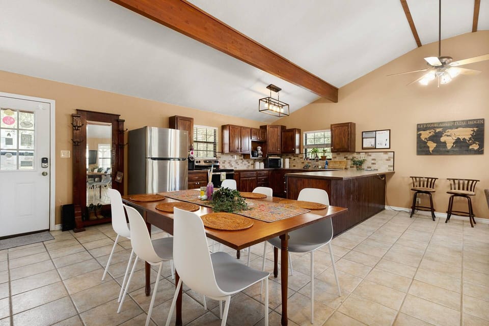 Dining table with seating for six, perfect for shared meals and conversation after a day of Hill Country adventure.
