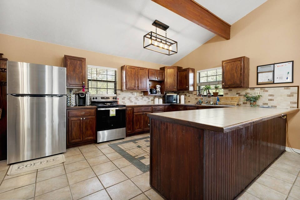 Guests can gather around the kitchen peninsula while you whip up a snack or full meal.