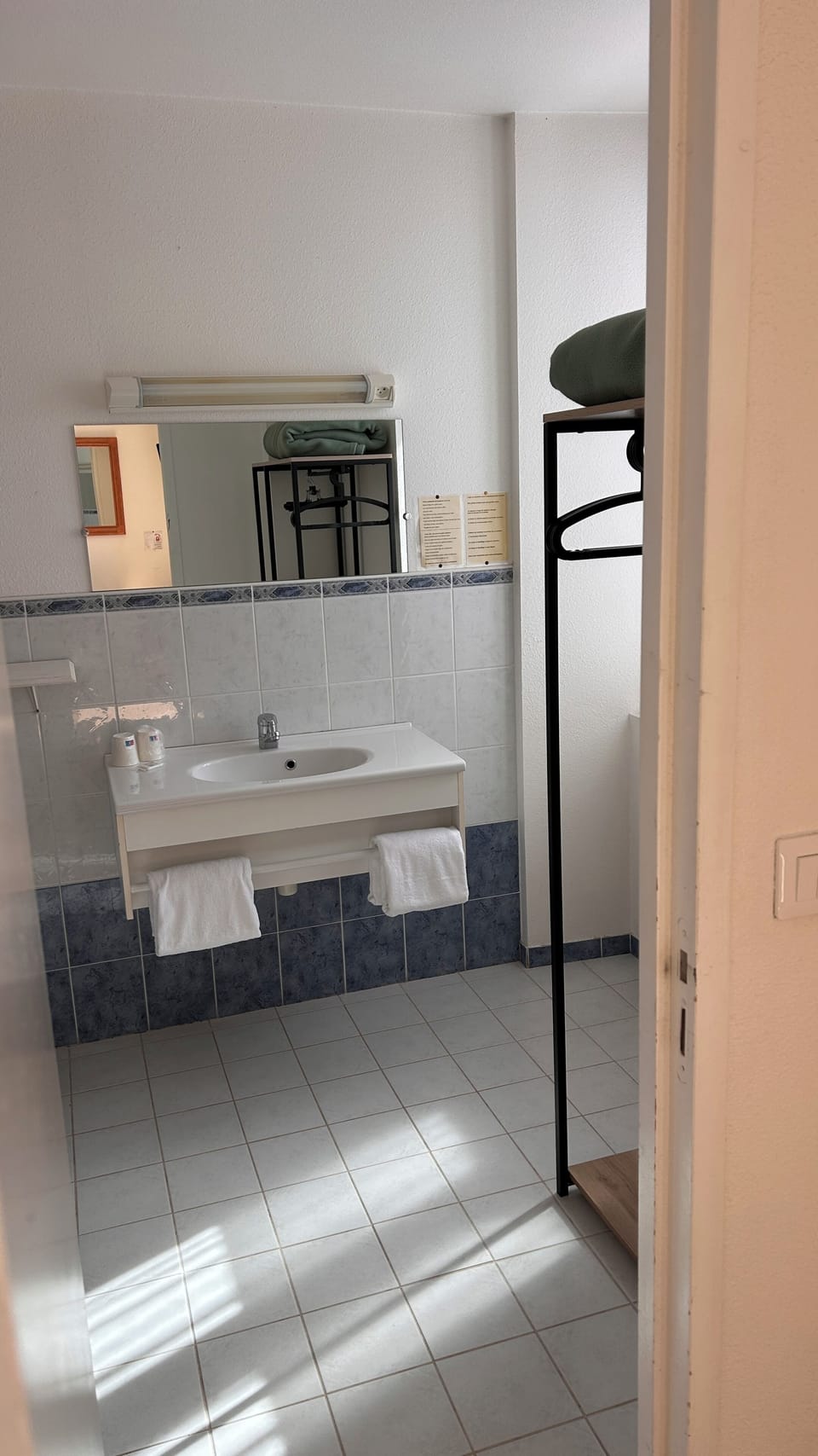 Shower, rainfall showerhead, hair dryer, towels
