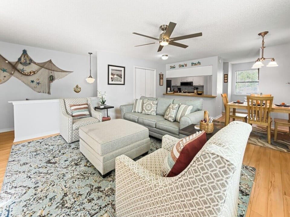Living room - open to Kitchen- Dining Area- Balcony - Couch is queen sized pull out sleeper