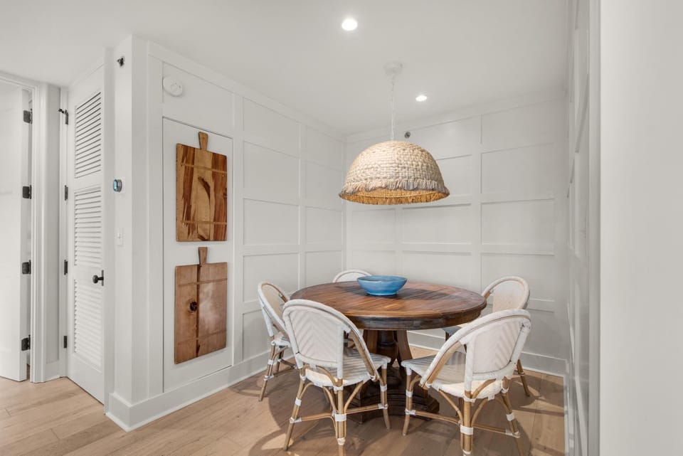 Cozy dining nook with natural light and woven pendant light
