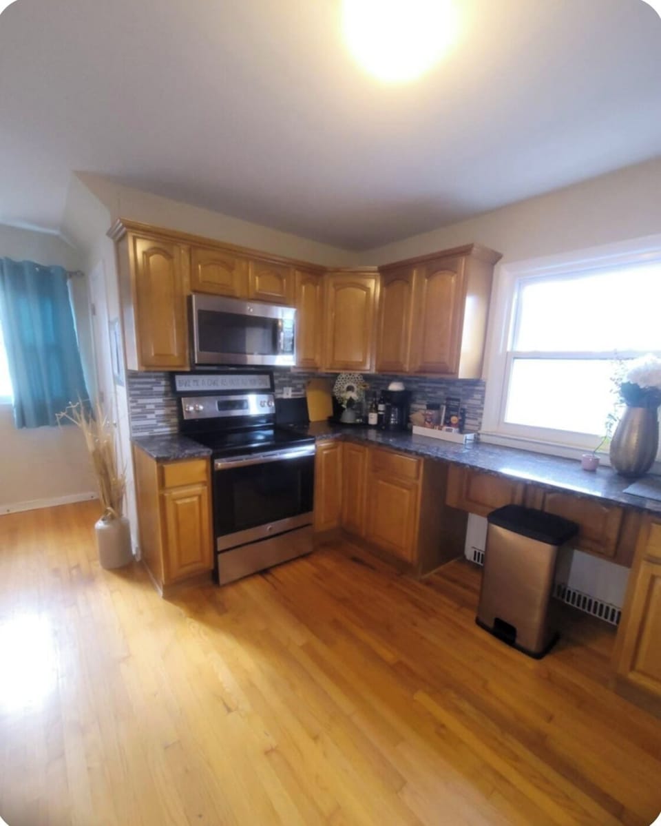 Open concept kitchen cozy for a quick fix without missing out on TV/family time!