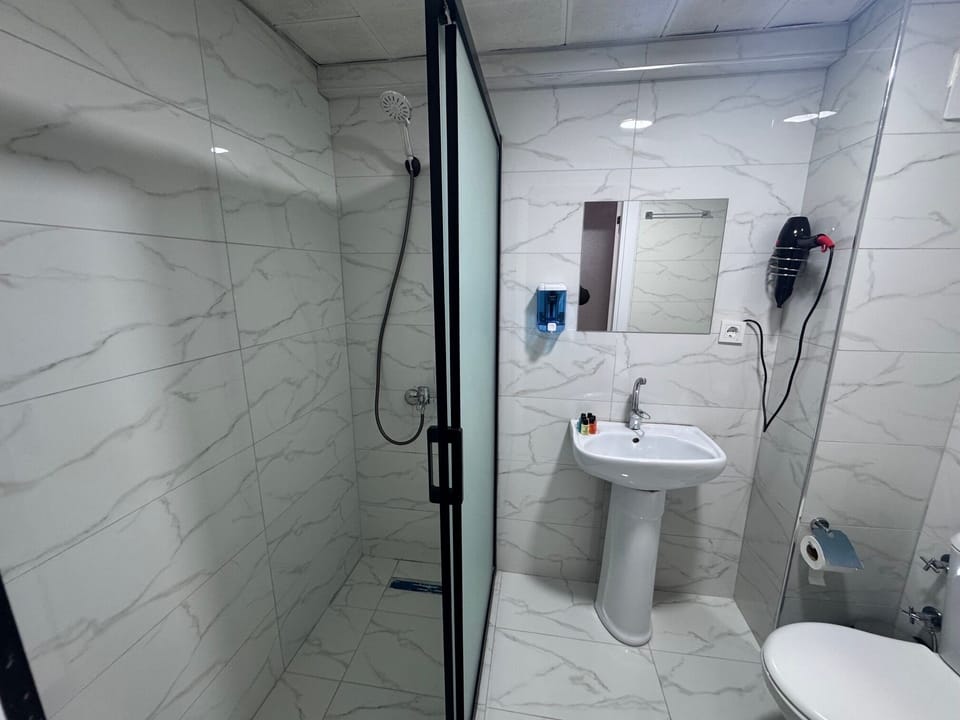 Double Room | Bathroom | Hair dryer, slippers, towels, soap