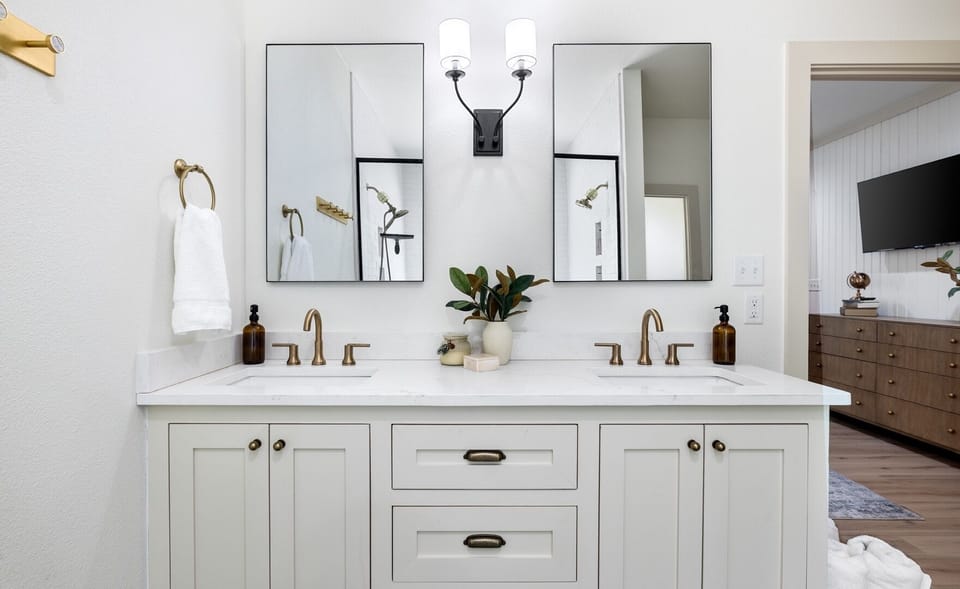 Spa-like primary bath features dual sinks . . . 