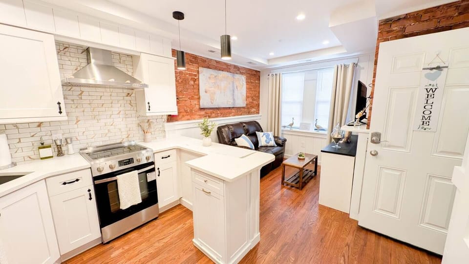 Fully refinished living space with full kitchen and seating area