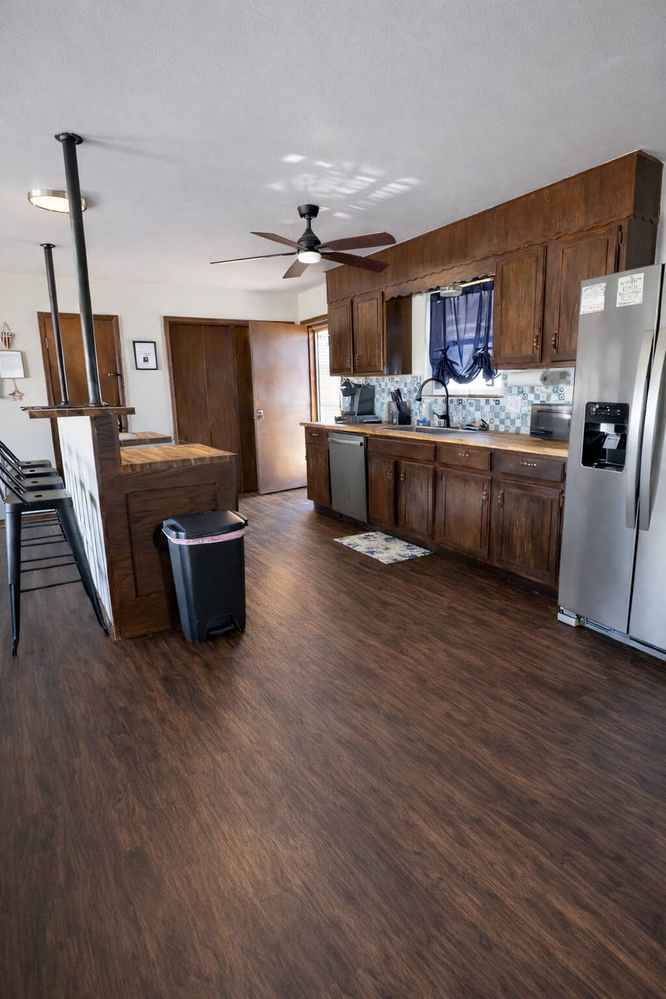 Full kitchen, with Stove, Oven-built in Air Fryer, Refrigerator.