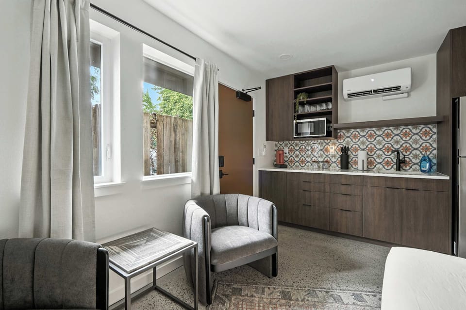 Sitting area beside the kitchen and window.