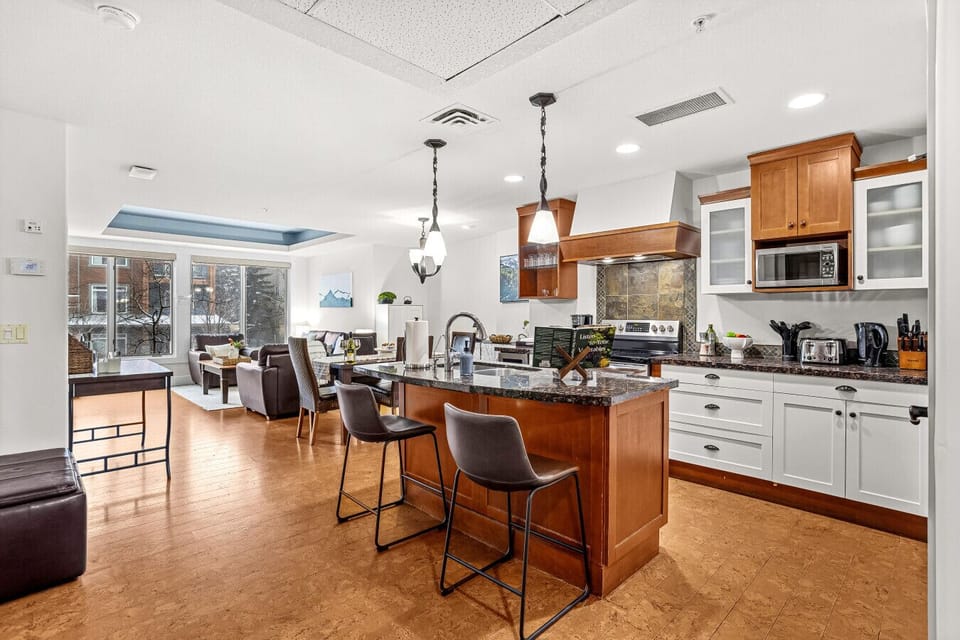 The full kitchen is quipped with modern appliances and basic essentials to make meal preparation easy.