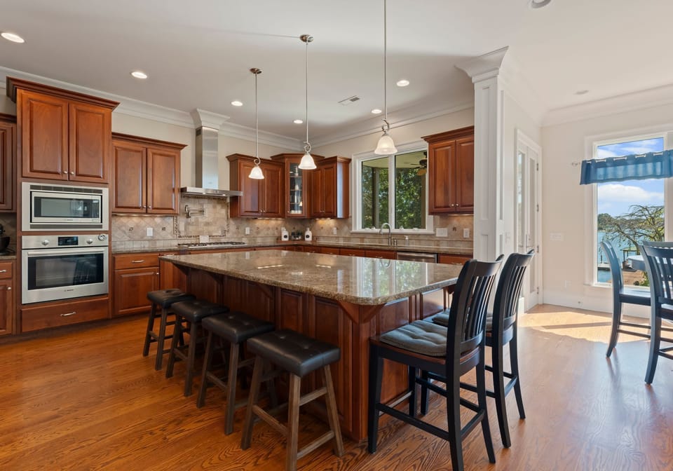 Fully stocked kitchen with island seating for 6.