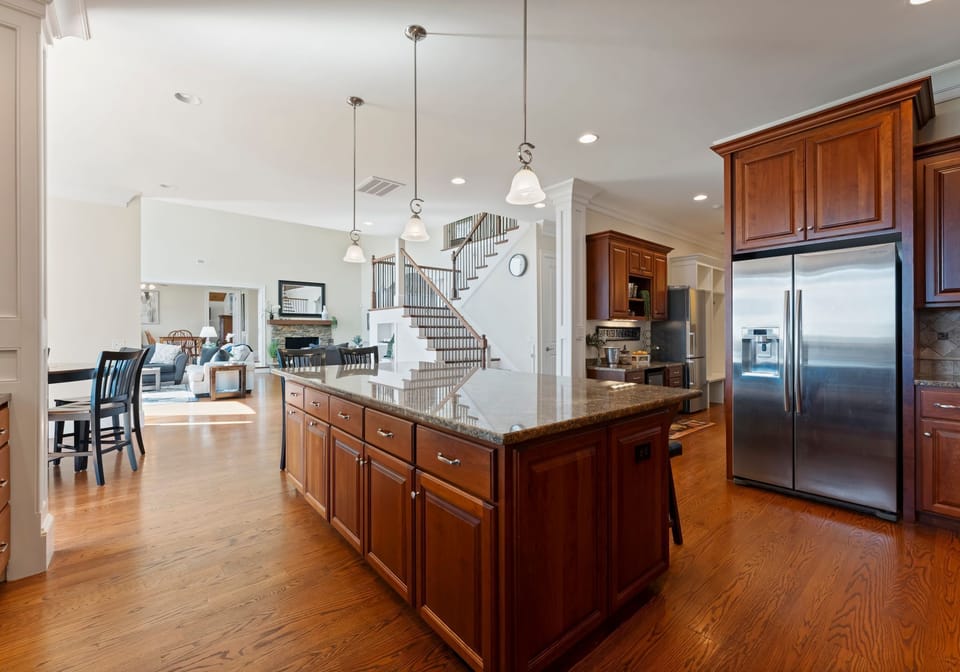 Fully stocked kitchen with island seating for 6.