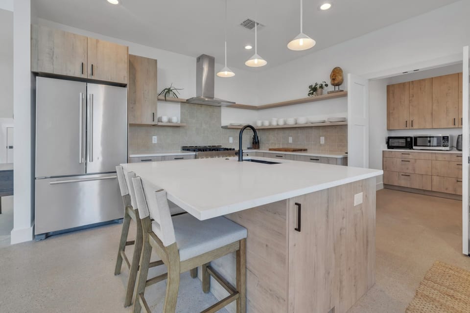Kitchen with island and gas range. 