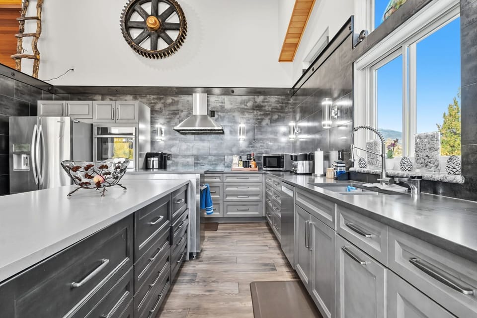 Kitchen: Main floor, drip coffee maker, Keurig, toaster, air fryer, cooking utensils, tableware