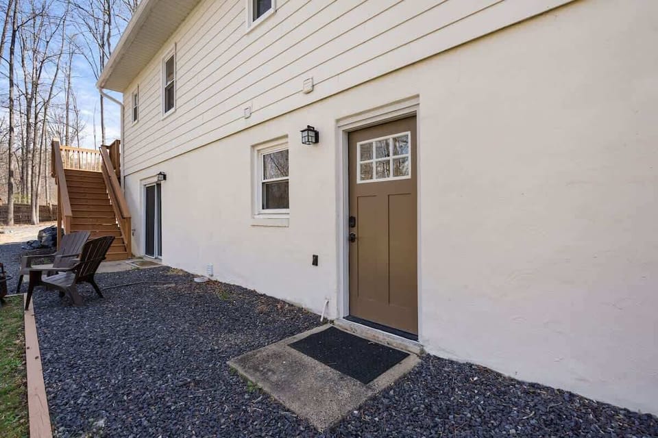 Private ground-floor entrance with stairs to upper level