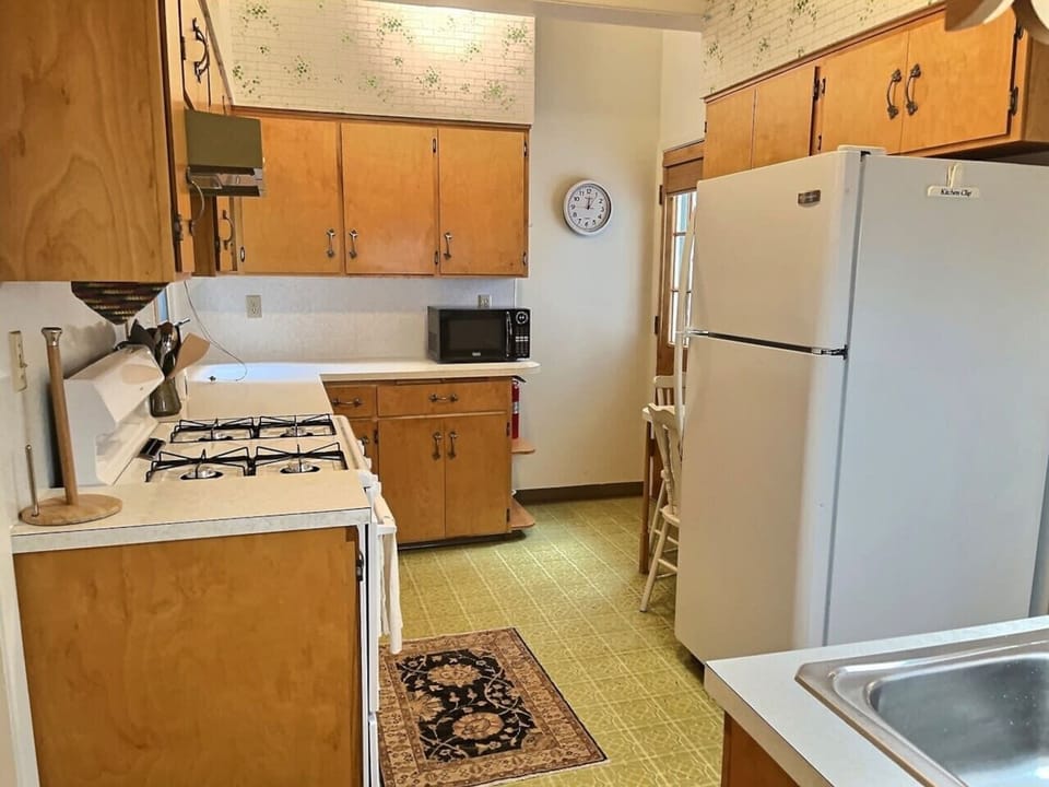 Kitchen with cooking supplies and coffee station