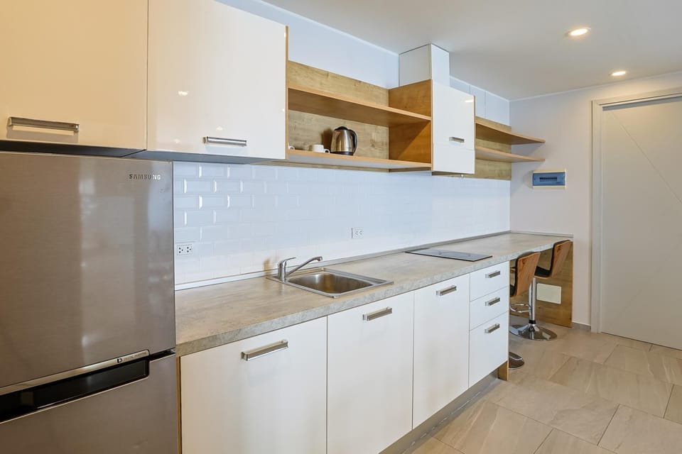 Apartment, Balcony | Private kitchenette | Full-size fridge, microwave, stovetop, electric kettle
