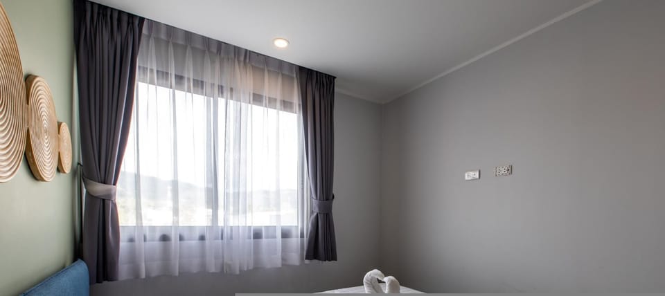 Apartment, Balcony, Mountain View | In-room safe, blackout drapes, iron/ironing board, free WiFi