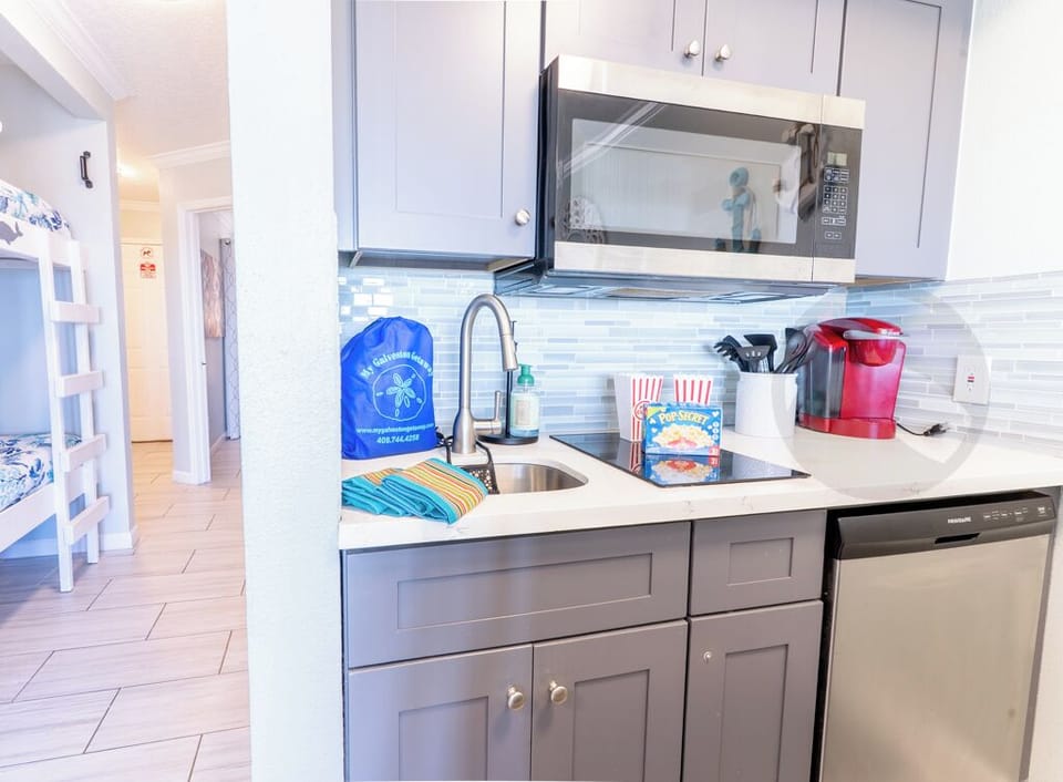cooktop, microwave, dishwasher, refrigerator and countertop oven