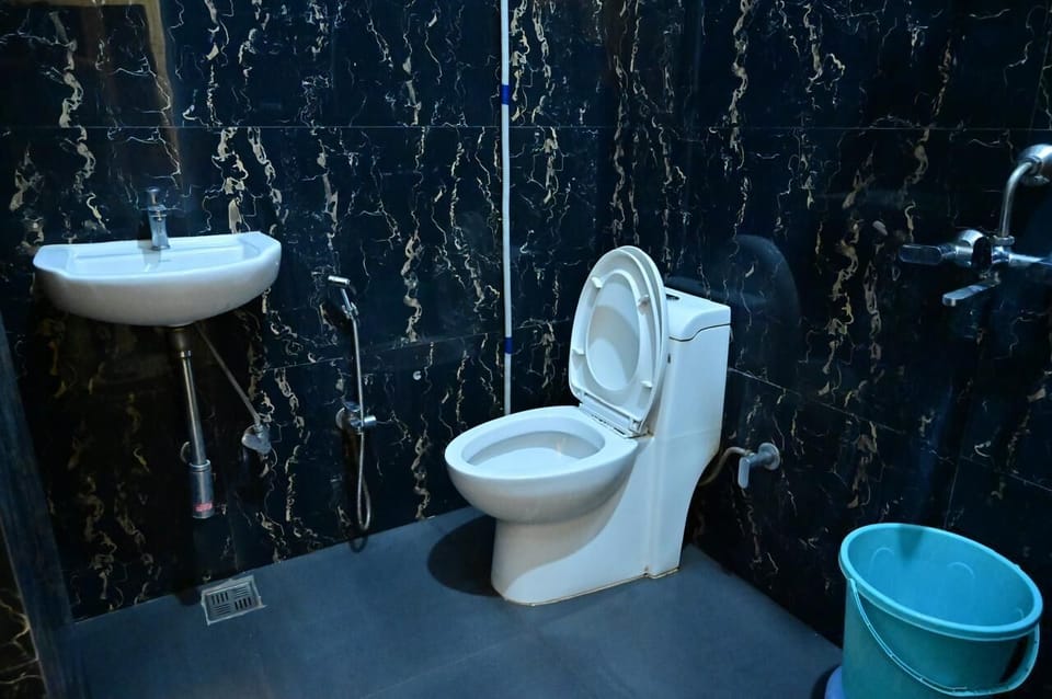 Family Double Room, Air conditioning | Bathroom | Shower, rainfall showerhead, slippers, towels