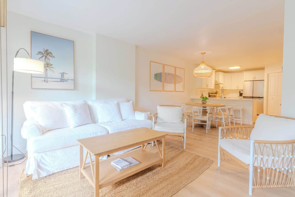 Bright coastal living room filled with natural light and airy, beachy vibes.