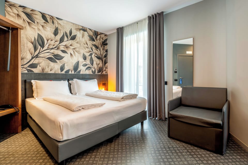 Junior Suite, Balcony | Minibar, in-room safe, soundproofing, iron/ironing board