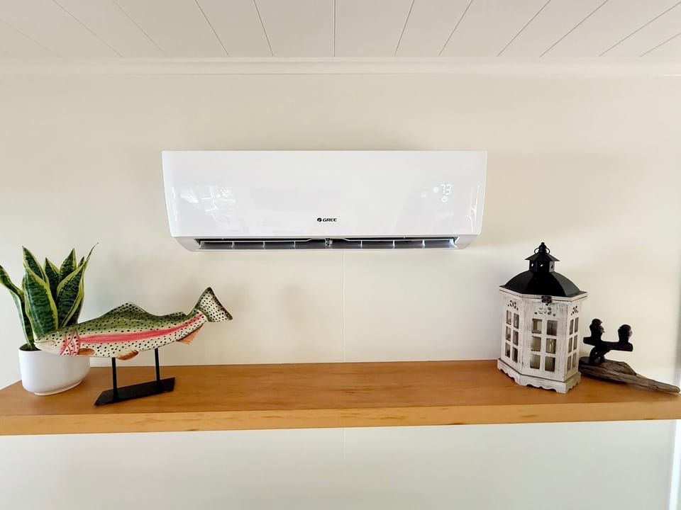 LIVING ROOM:  The living room features a mini-split dual heater and air conditioning unit to keep the cabin comfortable at all times.