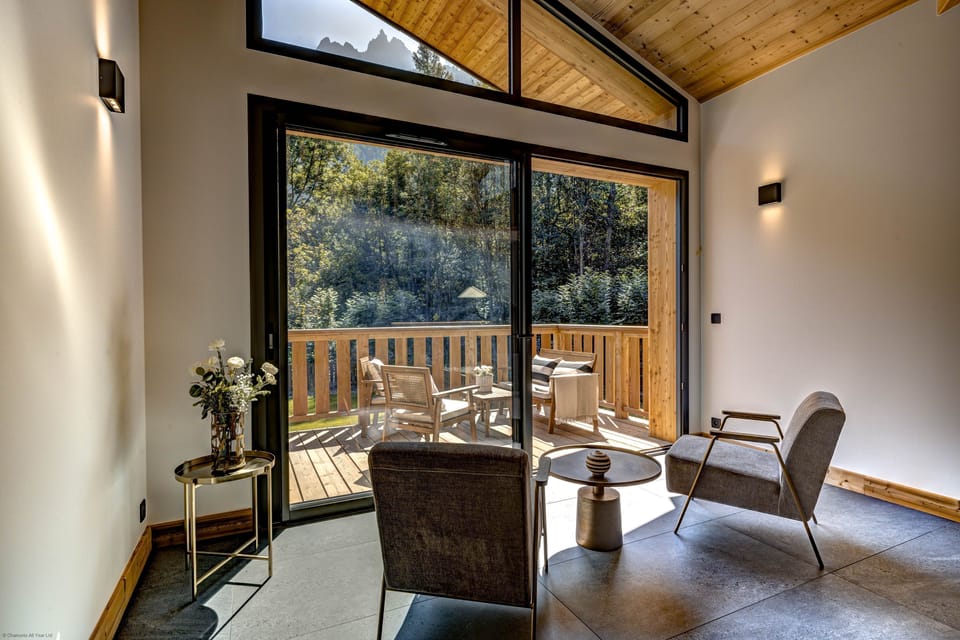Large windows flood light into the living area