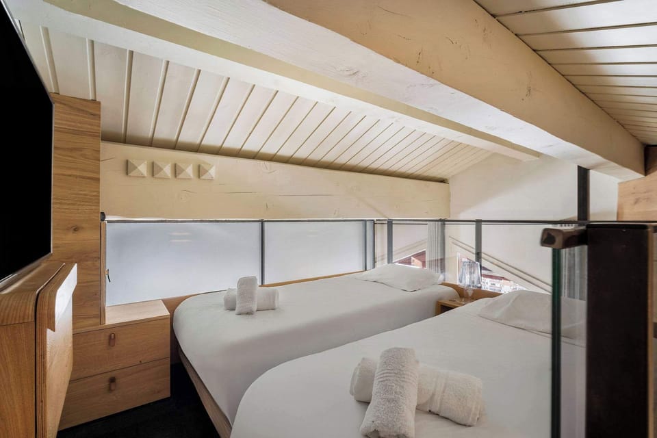 Peaceful retreat steps from the pistes—romantic double room in a ski-in/ski-out apartment.