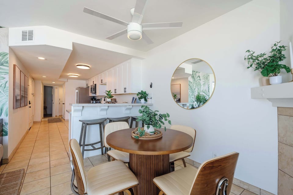 Open-concept living and dining space perfect for gathering after a day at the beach.