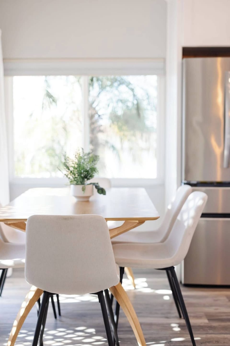 Dine together by the open glass doors on a warm afternoon 