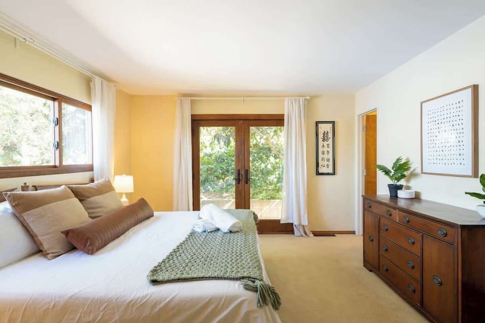 Wake feeling refreshed in the beautiful master bedroom that invites the outside in