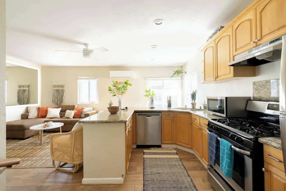 Catch up with friends while you cook overlooking the living space